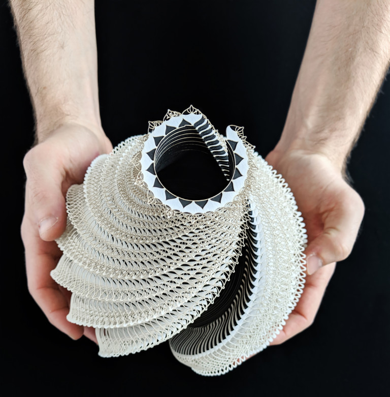 Laser-Cut Paper Coils Into Intricate Vessels That Contrast Human Touch and Technology