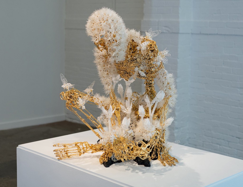 Delicate Flowers and Wings Flutter Across Gold Skeletons in Casey Curran’s Kinetic Sculptures