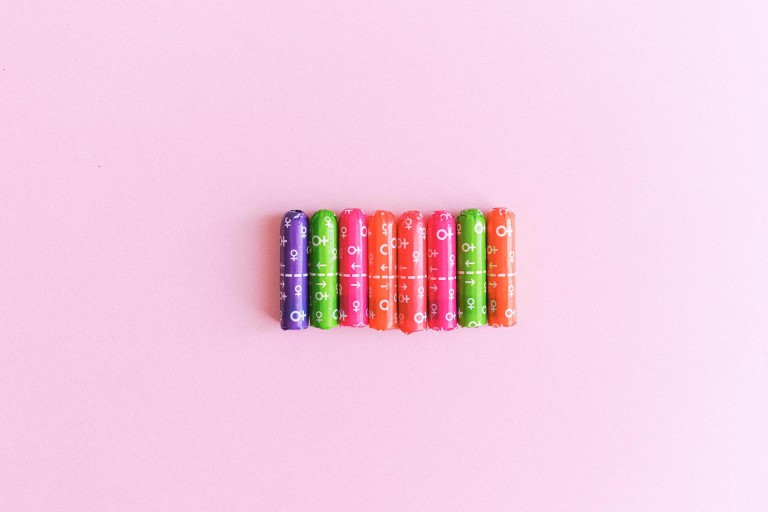 Photo of brightly packaged tampons by Anna Shvets.