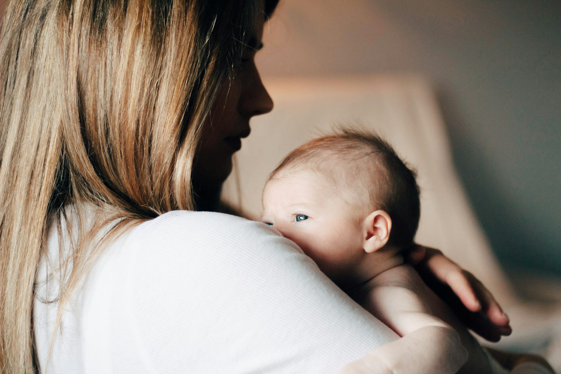 The age you have your first child predicts your long-term educational and financial success